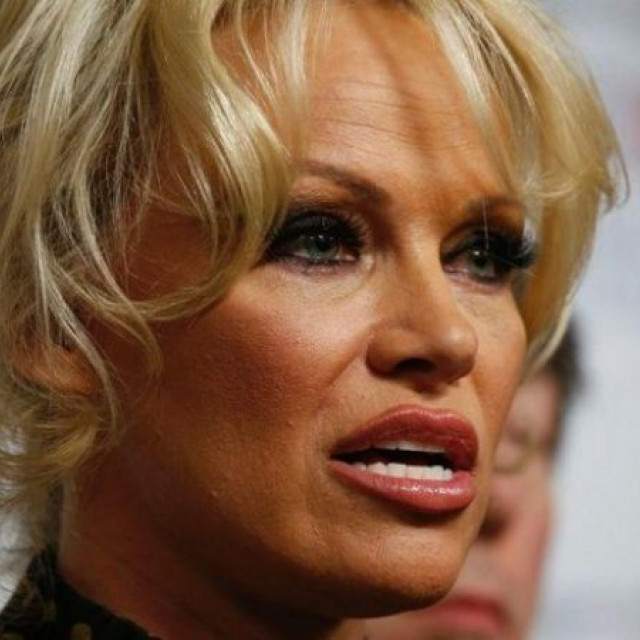 Pamela Anderson meets with Marcel football player