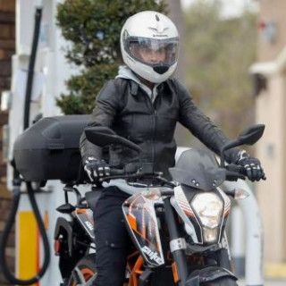 Halle Berry chases Malibu on a motorcycle