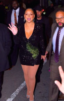 Mariah Carey in a poor mini showed full legs