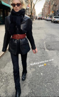 Elsa Hosk walks in Brooklyn in a black leather jacket