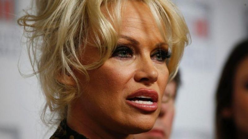 Pamela Anderson meets with Marcel football player