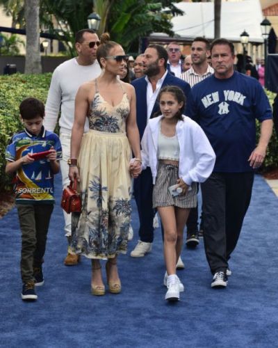 Happy Jennifer Lopez with kids jumping
